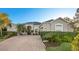 Beautifully landscaped home with a brick driveway and well-manicured lawn at 3930 Hydrangea Ct, Oviedo, FL 32766