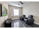 Cozy living room featuring black leather recliners and a large screen TV at 3930 Hydrangea Ct, Oviedo, FL 32766