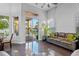 Bright living area with tile floors, sliding glass doors to outdoor patio, and modern furnishings at 3930 Hydrangea Ct, Oviedo, FL 32766