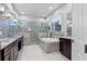 Bright primary bathroom featuring dual vanity, walk-in shower, and separate tub at 3930 Hydrangea Ct, Oviedo, FL 32766