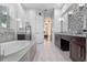 Spacious main bathroom with dual sink vanity, standalone tub, and walk-in shower at 3930 Hydrangea Ct, Oviedo, FL 32766