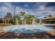 Community splash pad and picnic area with palm trees and a shaded seating area at 3930 Hydrangea Ct, Oviedo, FL 32766