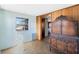 Bedroom featuring wood paneling, a large armoire and a sunny window at 425 S Woodland St, Winter Garden, FL 34787