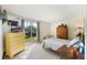 Bright bedroom featuring a sliding glass door, vintage dresser, and comfortable furnishings at 425 S Woodland St, Winter Garden, FL 34787