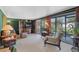 Bright living room with large windows and views of the outdoors, creating a serene atmosphere at 425 S Woodland St, Winter Garden, FL 34787