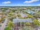 Aerial view of a community featuring well-maintained apartment buildings, parking lots and landscaping at 4540 Commander Dr # 2236, Orlando, FL 32822