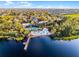 Breathtaking aerial view of a community situated near a lake, featuring a beach and pool at 506 New Providence Promenade # 506, Davenport, FL 33897