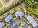 Aerial view of the community featuring the buildings, parking, and landscaping at 506 New Providence Promenade # 506, Davenport, FL 33897