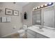 A cozy bathroom featuring tile floors, decor, and vanity at 506 New Providence Promenade # 506, Davenport, FL 33897