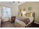 Comfortable bedroom with two twin beds, natural light, and a cozy atmosphere at 506 New Providence Promenade # 506, Davenport, FL 33897