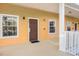Inviting entryway featuring the unit number, two windows, and a neutral color scheme at 506 New Providence Promenade # 506, Davenport, FL 33897