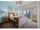 Bright main bedroom with a private balcony, stylish decor, and neutral tones at 506 New Providence Promenade # 506, Davenport, FL 33897