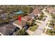 Aerial view of a neighborhood highlighting the home's location in a community with a tennis court at 5251 Wildwood Way, Davenport, FL 33837
