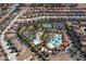 Aerial view of the community highlighting the pools, clubhouse, tennis courts, and surrounding homes at 5251 Wildwood Way, Davenport, FL 33837