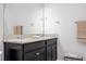 Bathroom featuring double sinks with granite countertops and a large mirror at 5251 Wildwood Way, Davenport, FL 33837