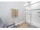 Bathroom with a glass enclosed shower and neutral-colored tile flooring at 5251 Wildwood Way, Davenport, FL 33837