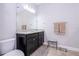 Bathroom featuring a granite countertop vanity and a toilet at 5251 Wildwood Way, Davenport, FL 33837