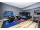 Bedroom designed as a gaming room, complete with bunk beds and multiple monitors at 5251 Wildwood Way, Davenport, FL 33837