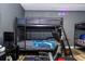 Close up of bunk beds, desk, and gaming area in gaming room at 5251 Wildwood Way, Davenport, FL 33837