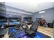 View of gaming room, with multiple bunk beds, gaming chairs, and neon lights at 5251 Wildwood Way, Davenport, FL 33837