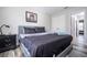Comfortable bedroom showcases a queen bed, modern decor, and ample closet space at 5251 Wildwood Way, Davenport, FL 33837