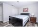 Charming bedroom showcasing a queen bed, wood-look floors, and ample closet space at 5251 Wildwood Way, Davenport, FL 33837