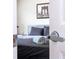 Bedroom peek shows gray linens, and the modern door handle shows safety & easy access at 5251 Wildwood Way, Davenport, FL 33837