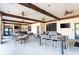 Open community area with ceiling fans, mounted television, tables, and chairs for seating and entertaining at 5251 Wildwood Way, Davenport, FL 33837