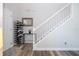 Inviting entryway with a staircase, featuring a shoe rack and decor, with wood-look floors at 5251 Wildwood Way, Davenport, FL 33837