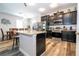 Well-lit kitchen with granite countertops, stainless steel appliances, and a breakfast bar at 5251 Wildwood Way, Davenport, FL 33837