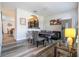 Open concept living area with a poker table and bar pass-through to the kitchen, stainless steel appliances at 5251 Wildwood Way, Davenport, FL 33837
