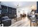 Spacious living area with a modern ceiling fan, dining space, open kitchen, and chic decor at 5251 Wildwood Way, Davenport, FL 33837