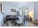 Versatile living space with a poker table, perfect for entertaining, complemented by natural light and modern decor at 5251 Wildwood Way, Davenport, FL 33837