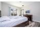 Bedroom featuring a sliding glass door, dresser with a TV, and neutral decor at 5251 Wildwood Way, Davenport, FL 33837
