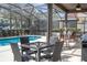 Inviting pool area features outdoor seating for dining and relaxing by the pool at 5251 Wildwood Way, Davenport, FL 33837