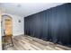 Home theater under construction with hardwood floors, black dividing curtains and speakers at 5251 Wildwood Way, Davenport, FL 33837
