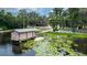 Aerial view of a beautiful lakefront property with boat docks and outdoor seating areas at 5584 N Dean Rd, Orlando, FL 32817