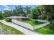 Brick home with a fenced backyard and screened porch, offering privacy at 5584 N Dean Rd, Orlando, FL 32817
