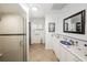 Clean bathroom with a glass-enclosed shower, vanity, and tile flooring at 5584 N Dean Rd, Orlando, FL 32817