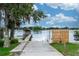 Scenic boat ramp leading to a serene lake, complemented by lush greenery at 5584 N Dean Rd, Orlando, FL 32817