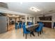 Open concept living space with dining area connected to the kitchen and bar seating at 5584 N Dean Rd, Orlando, FL 32817