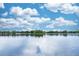 Panoramic lake view with clear blue skies reflecting on the calm water at 5584 N Dean Rd, Orlando, FL 32817