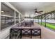 Enclosed patio that has lots of room and a neutral colored furniture set at 5584 N Dean Rd, Orlando, FL 32817