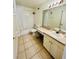 Bathroom with a shower-tub combo, and tile flooring at 601 Washington Palm Loop, Davenport, FL 33897