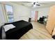 Bedroom features a large window offering scenic views of the pond at 601 Washington Palm Loop, Davenport, FL 33897