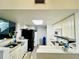 Functional kitchen featuring white cabinetry, modern appliances, and practical countertops, perfect for cooking at 601 Washington Palm Loop, Davenport, FL 33897