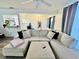 Bright living room featuring a comfortable sectional sofa and open layout at 601 Washington Palm Loop, Davenport, FL 33897