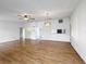 Bright living room featuring hardwood floors, a chandelier, and lots of wall space at 606 Heraldo Ct, Kissimmee, FL 34758