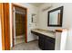 Bathroom features a sink with granite counters, a mirror, and an open shower at 7440 Windsome Ct, Orlando, FL 32810