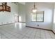 Spacious living room showcasing tile floors, natural light, and an open layout at 7440 Windsome Ct, Orlando, FL 32810